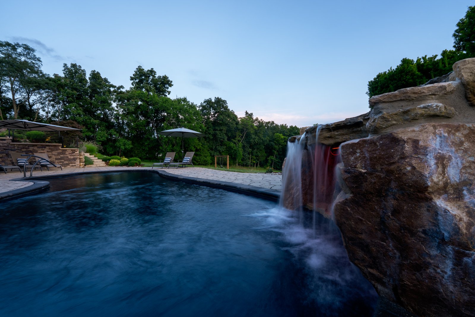 Moonrise Pool &mdash; pool and rock waterfall at blue hour.