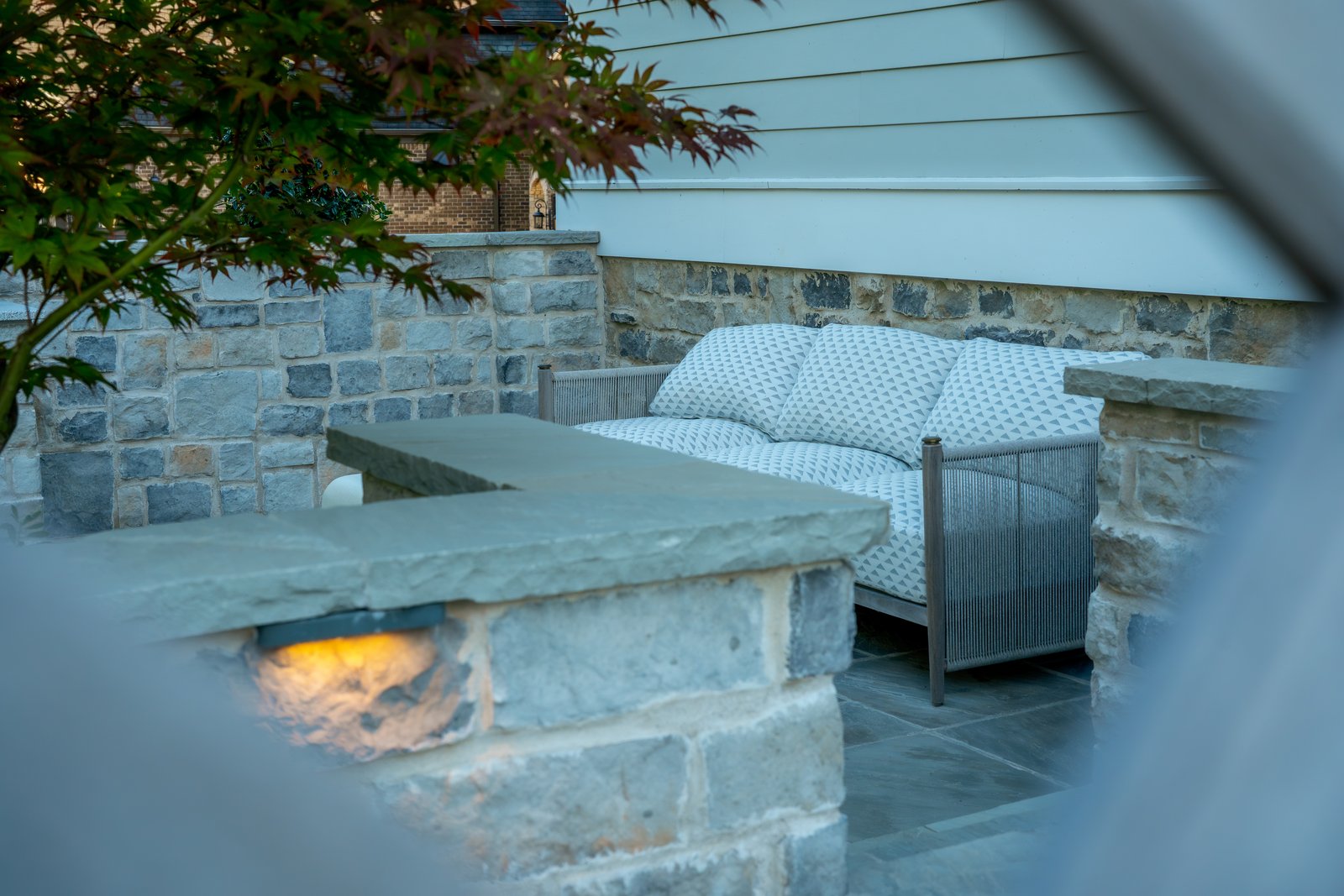 Lit stone bar and counter on a terrace