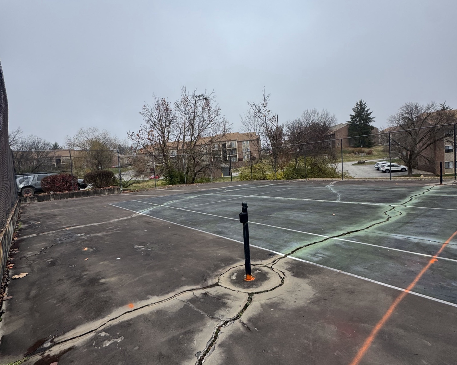 The original Boulder Creek tennis courts &mdash; cracked, locked, and fenced off.
