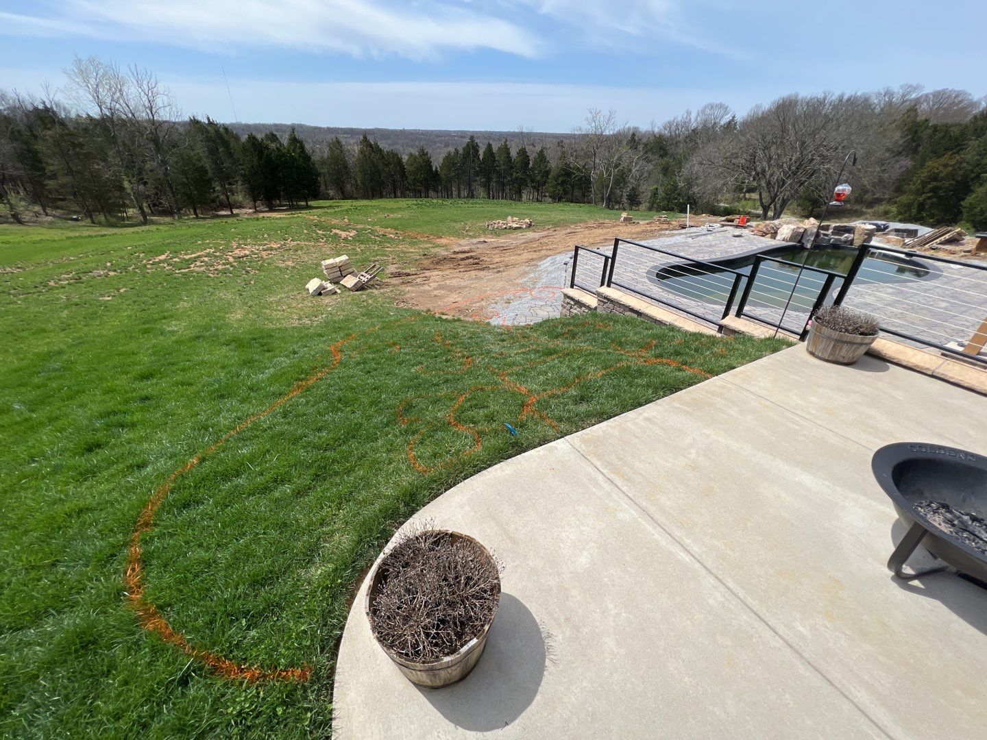 Before: the walkout was grass in every direction &mdash; no pool, no gathering space, no way to live outside.